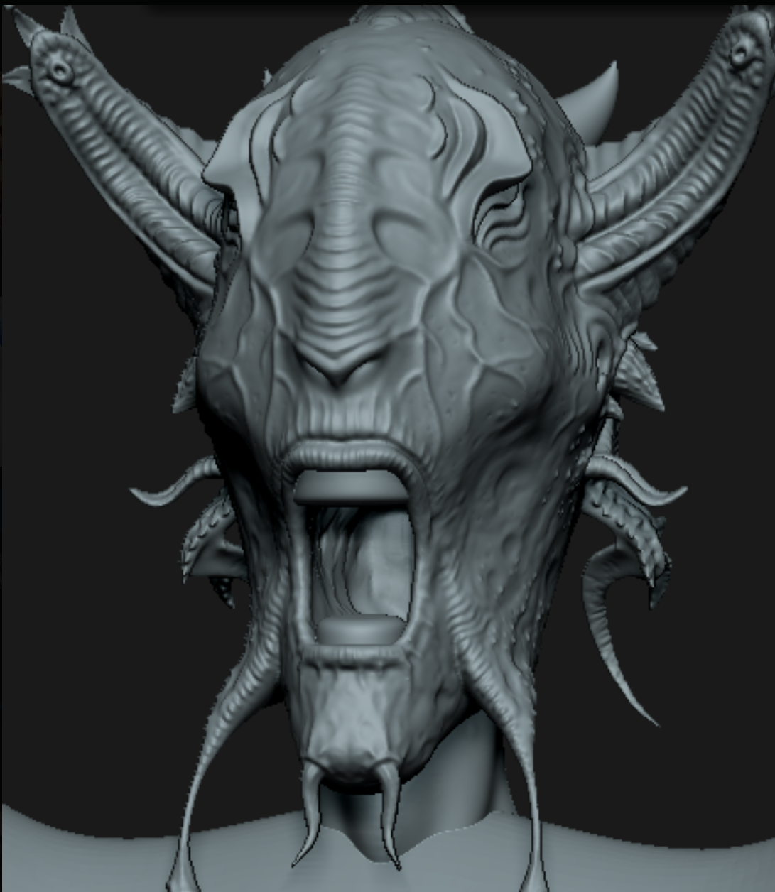 The original grey 3D sculpt — a horned, tendrilled creature head, untextured